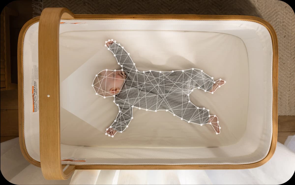 Baby resting peacefully in a Cradlewise crib